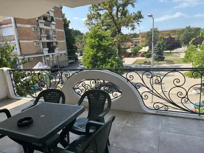 a patio with a table and chairs on a balcony at Apartman Popovic 2 in Ub