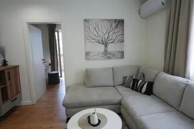 a living room with a couch and a table at Stan na dan Bulevar in Belgrade