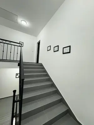 a staircase in a building with pictures on the wall at Deluxe Double Room Belgrade Airport in Surčin