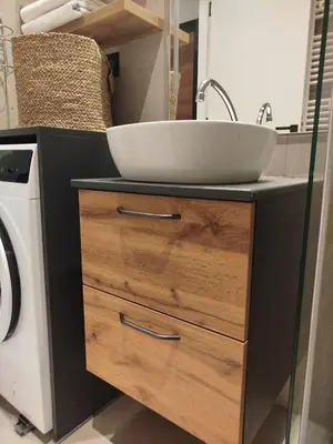 a bathroom with a sink and a washing machine at Tiny Nest - Sava Center, Belgrade in Belgrade