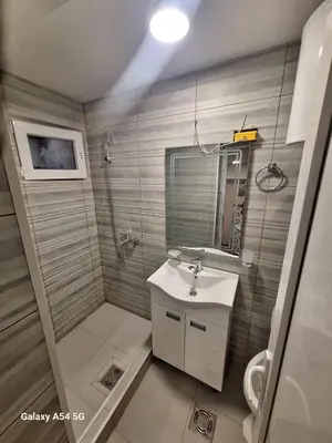 a small bathroom with a sink and a mirror at Dream 8 in Belgrade