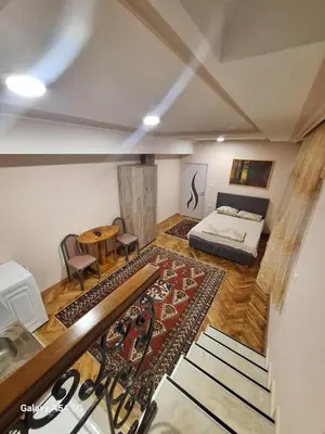 a large room with a bed and a table at Dream 8 in Belgrade