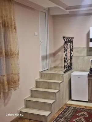 a stairway in a room with a white refrigerator at Dream 8 in Belgrade