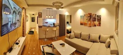 a living room with a couch and a bed at Aleksandar Residence in Belgrade