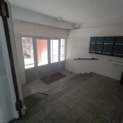 an empty room with windows in a building at Aleksandar Residence in Belgrade
