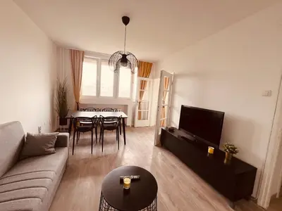 a living room with a couch and a table at Your cozy place! in Belgrade