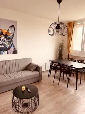 a living room with a couch and a table at Your cozy place! in Belgrade