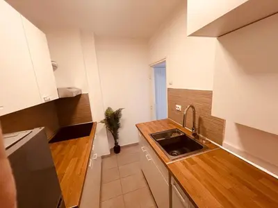 a small kitchen with a sink and a counter at Your cozy place! in Belgrade