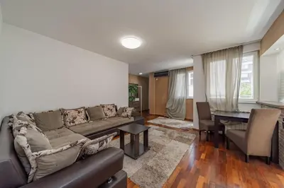 a living room with a couch and a table at Apartman Igor 1 in Belgrade