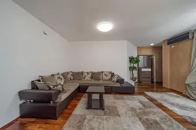 a living room with a couch and a table at Apartman Igor 1 in Belgrade