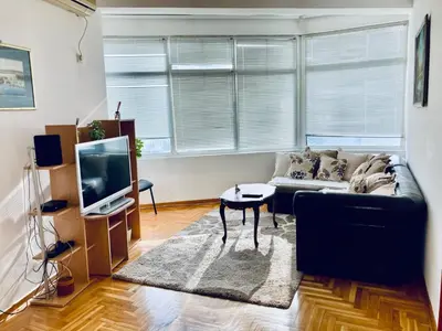 a living room with a couch and a tv at Apartman Igor 2 in Belgrade
