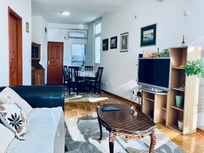 a living room with a couch and a table at Apartman Igor 2 in Belgrade