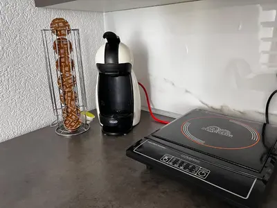 a coffee maker and a blender on a table at Galerija apartman in Arandjelovac