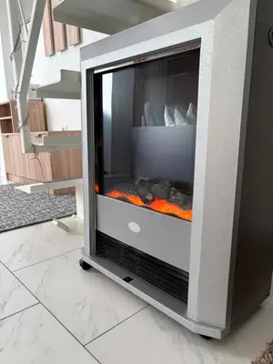 a fireplace in a living room with a fire place at Galerija apartman in Arandjelovac