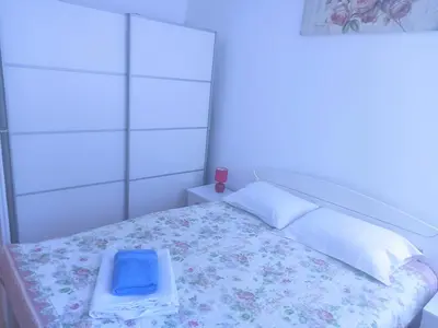 a bedroom with a bed with a tray on it at Marsala Family B&B in Belgrade