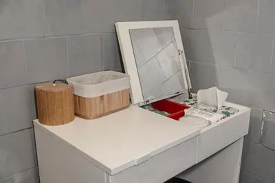 a mirror sitting on top of a white dresser at Obilicev venac DM in Belgrade