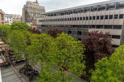 a group of trees in front of a building at Obilicev venac DM in Belgrade