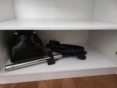 a shelf with a camera and a gun on it at Apartment Endorfin - Modern apartment close to airport in Surčin
