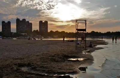 a lifeguard tower on a beach with people playing at Belgrade Serbia apartment in Belgrade