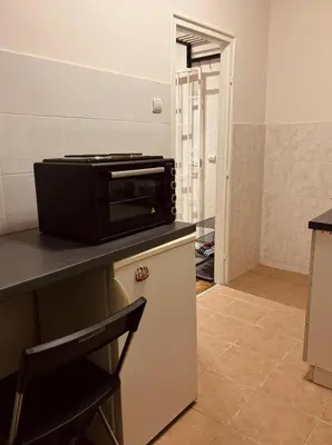 a microwave sitting on top of a counter in a kitchen at Old town Belgrade in Belgrade