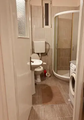 a bathroom with a toilet and a sink and a shower at Old town Belgrade in Belgrade