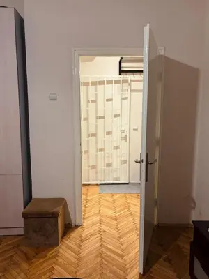 an open door to a room with a wooden floor at Old town Belgrade in Belgrade