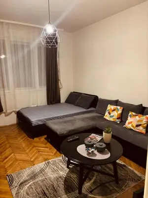 a living room with a couch and a table at Old town Belgrade in Belgrade