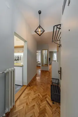 an open living room with a hardwood floor at Charming One Bedroom In The Heart of Belgrade in Belgrade