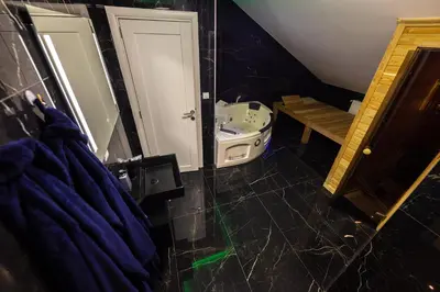 a bathroom with a sink and a toilet and a mirror at Oaza Apartmani Jakovo APOLON SPA in Jakovo