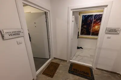 a bathroom with a walk in shower and a doorway at Oaza apartmani Jakovo VENERA in Jakovo