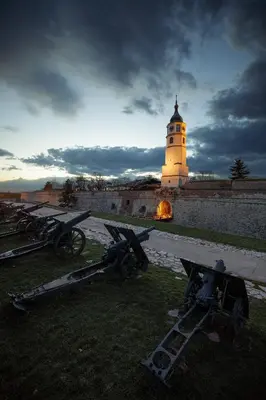 a light house with a clock tower in the background at Oaza Apartmani Jakovo AFRODITA in Jakovo
