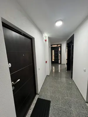 an empty hallway with a door and a hallwayngth at Loyal 1 in Arandjelovac