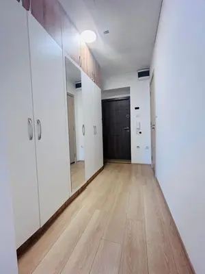 an empty room with white walls and a wooden floor at Cozy Little Place - Parking Available in Belgrade