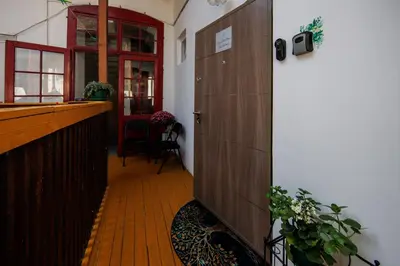 a hallway with a door and a bar in a room at Cozy Little Place - Parking Available in Belgrade