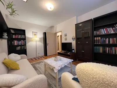a living room with two couches and a table at Belgrade Central Residence in Belgrade