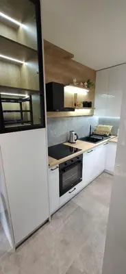 a kitchen with white cabinets and a stove top oven at LUX Casa di Stefan in Belgrade