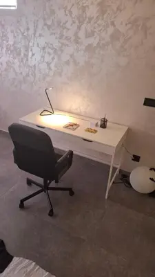 a desk with a chair and a lamp on it at LUX Casa di Stefan in Belgrade