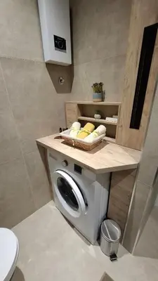 a bathroom with a washing machine with a counter at LUX Casa di Stefan in Belgrade