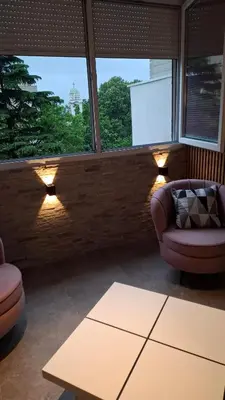 a living room with a couch and a table at LUX Casa di Stefan in Belgrade