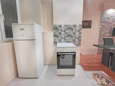 a kitchen with a refrigerator and a stove at Skaradlija Lux Apartment in Belgrade