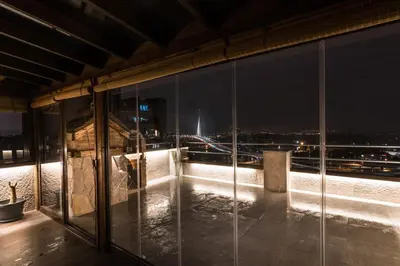 a view of the city from a building at night at Belgrade Penthouse - among the clouds in Belgrade