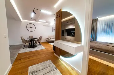 a living room with a kitchen and a dining room at Lux Brilijant Apartmant in Belgrade