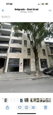 a picture of a building with a tree in front of it at Lux Brilijant Apartmant in Belgrade