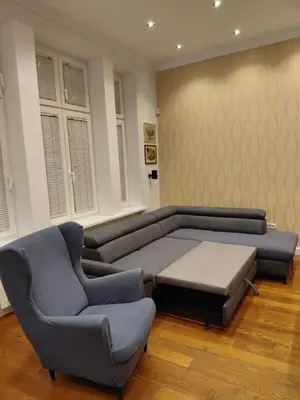 a living room with a couch and two chairs at World Traveler in Belgrade
