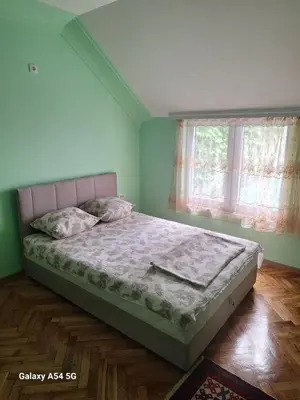 a bedroom with a bed in a room with a window at Dream 9 in Belgrade