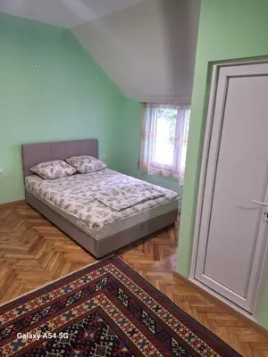 a bedroom with a bed next to a door at Dream 9 in Belgrade