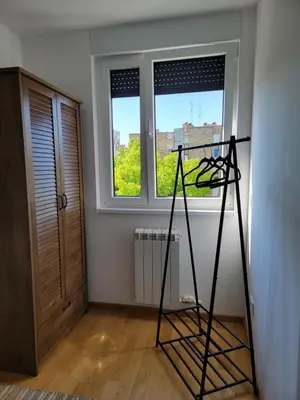 a room with a ladder in front of a window at Park Residence Apartman 1, Mirijevo, Beograd in Belgrade