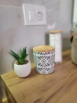 two vases sitting on a wooden table with a plant at Park Residence Apartman 1, Mirijevo, Beograd in Belgrade