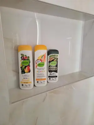 three containers of food sitting on a shelf in a refrigerator at Park Residence Apartman 1, Mirijevo, Beograd in Belgrade