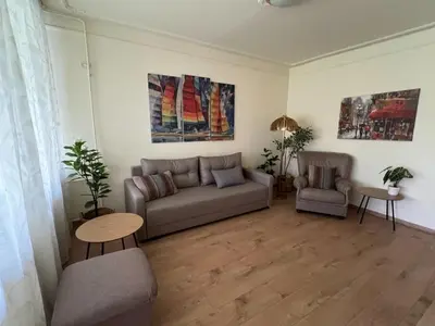 a living room with a couch and a table at R&R Apartmant Konjarnik in Belgrade